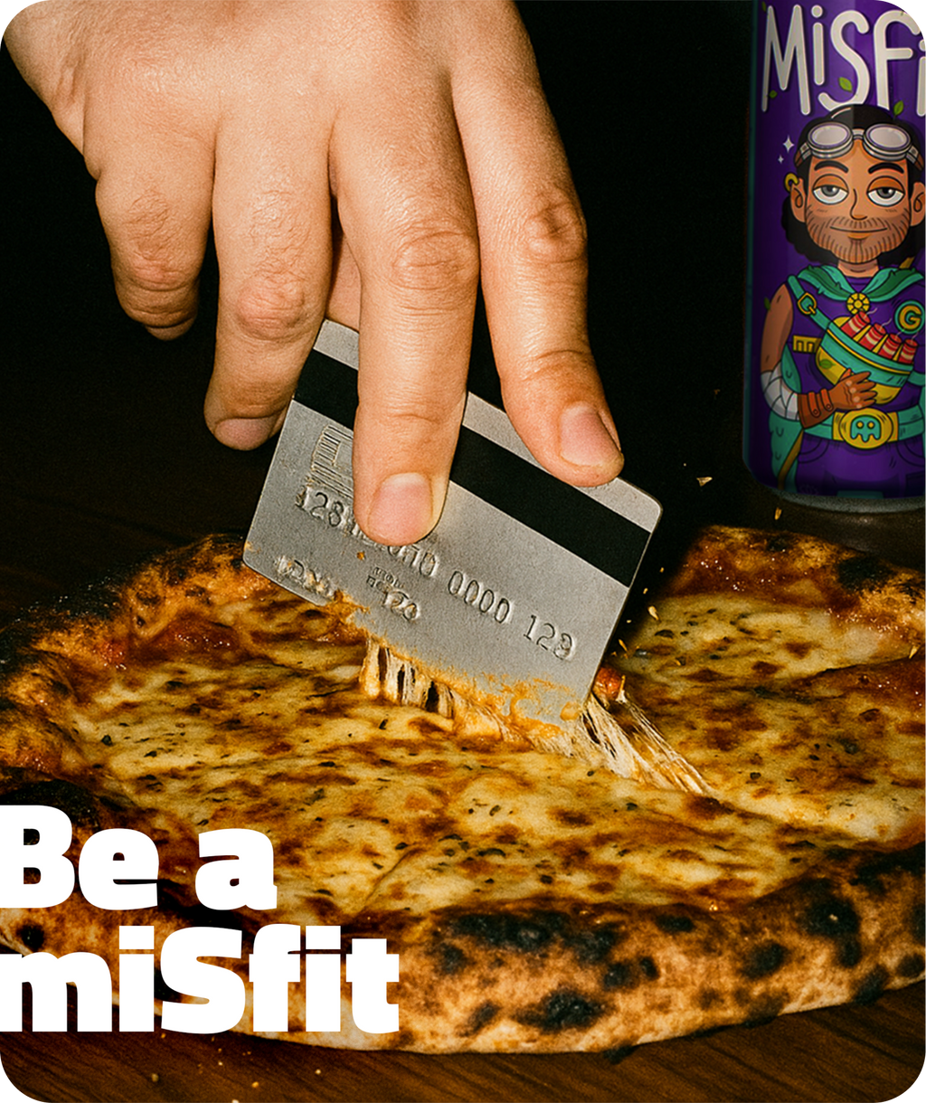 Person holding a can of Misfits soda against an orange background
